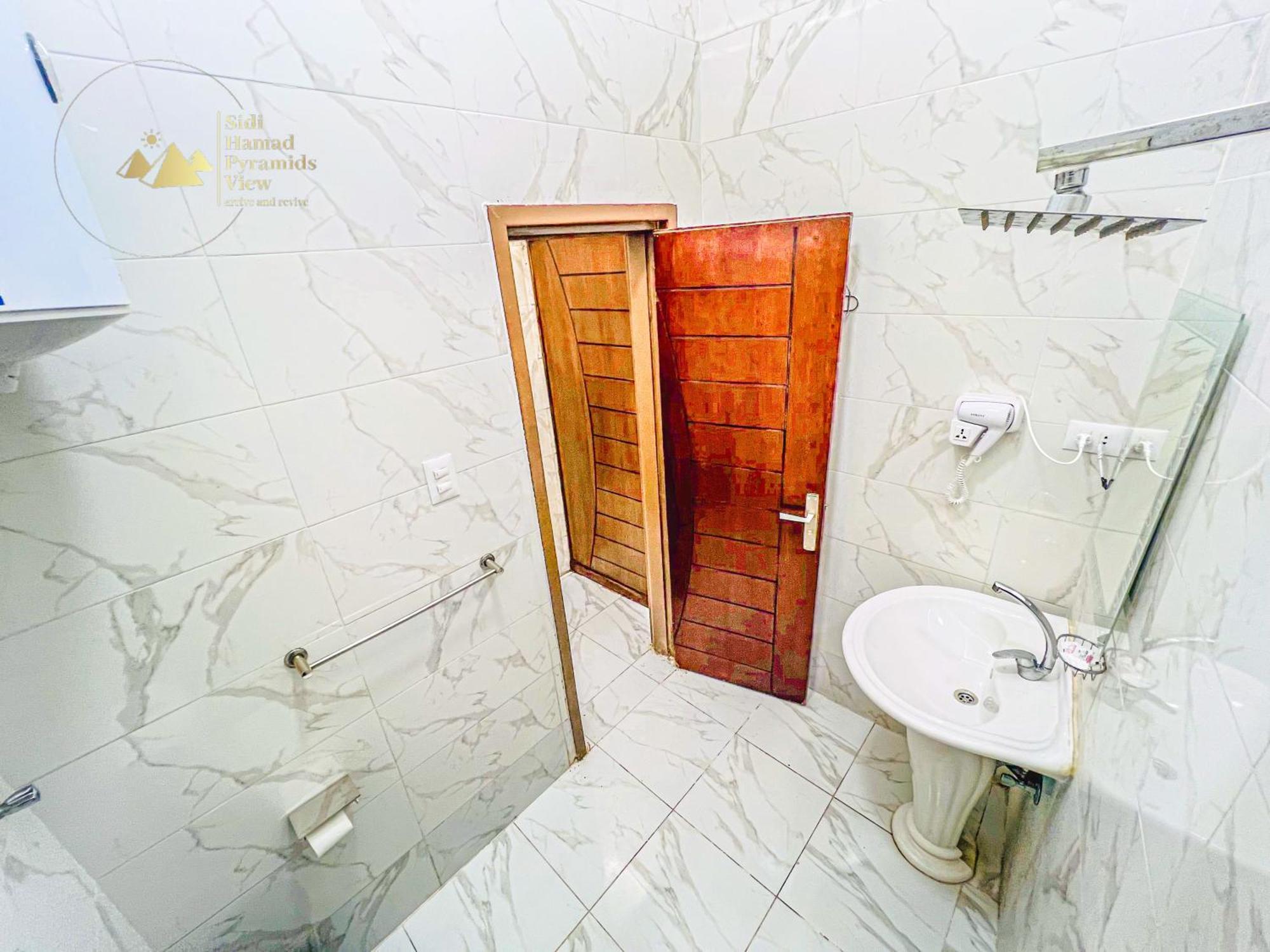 Sidi Hamad Pyramids View Hotel Kafrat al Jabal Bagian luar foto
