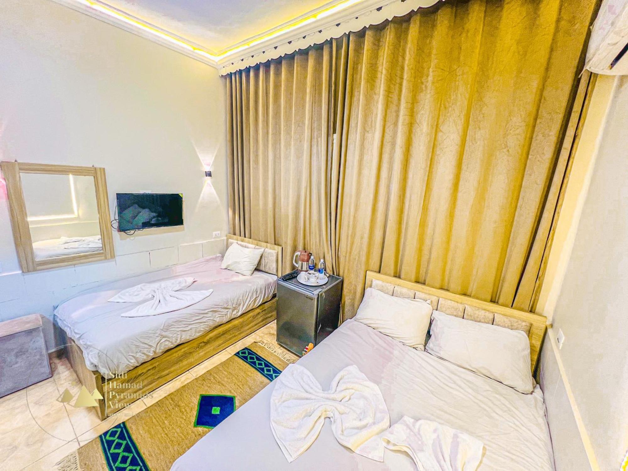 Sidi Hamad Pyramids View Hotel Kafrat al Jabal Bagian luar foto
